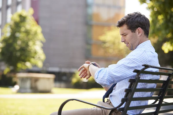 Businessman Looking At Smart Watch — Stock Photo, Image