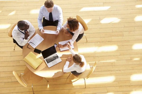 Four business colleagues in team meeting — Stock Photo, Image