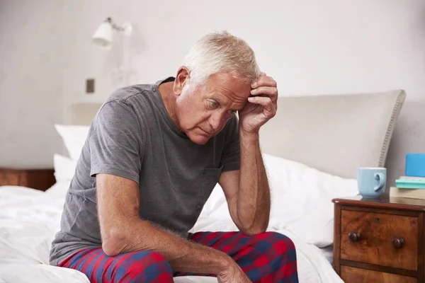 Senior Man Sitting On Bed — Stock Photo, Image