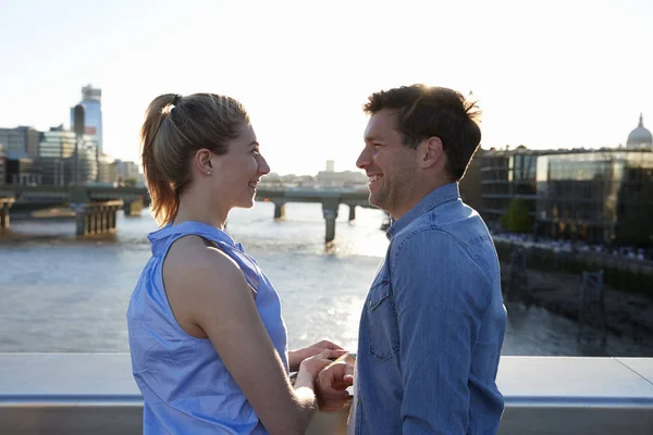Romantic couple on bridge — Stock Photo, Image