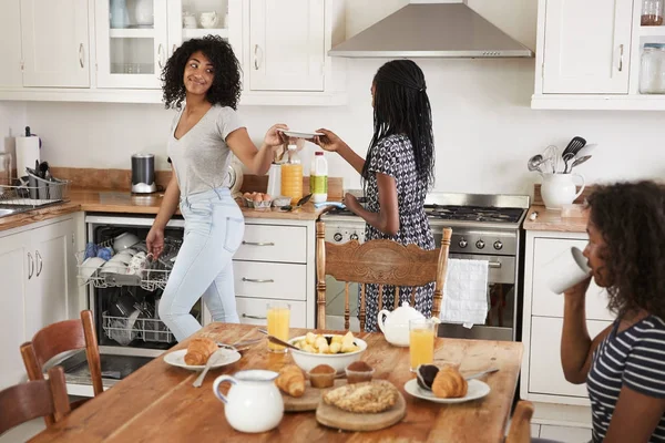 Girls Clearing Table After Family Breakfast — Stock Photo, Image