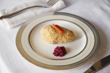 Jewish passover appetiser of gefilte fish and horseradish clipart