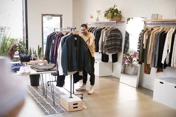 Young Hispanic Man Browsing Clothes Shop — Stock Photo, Image