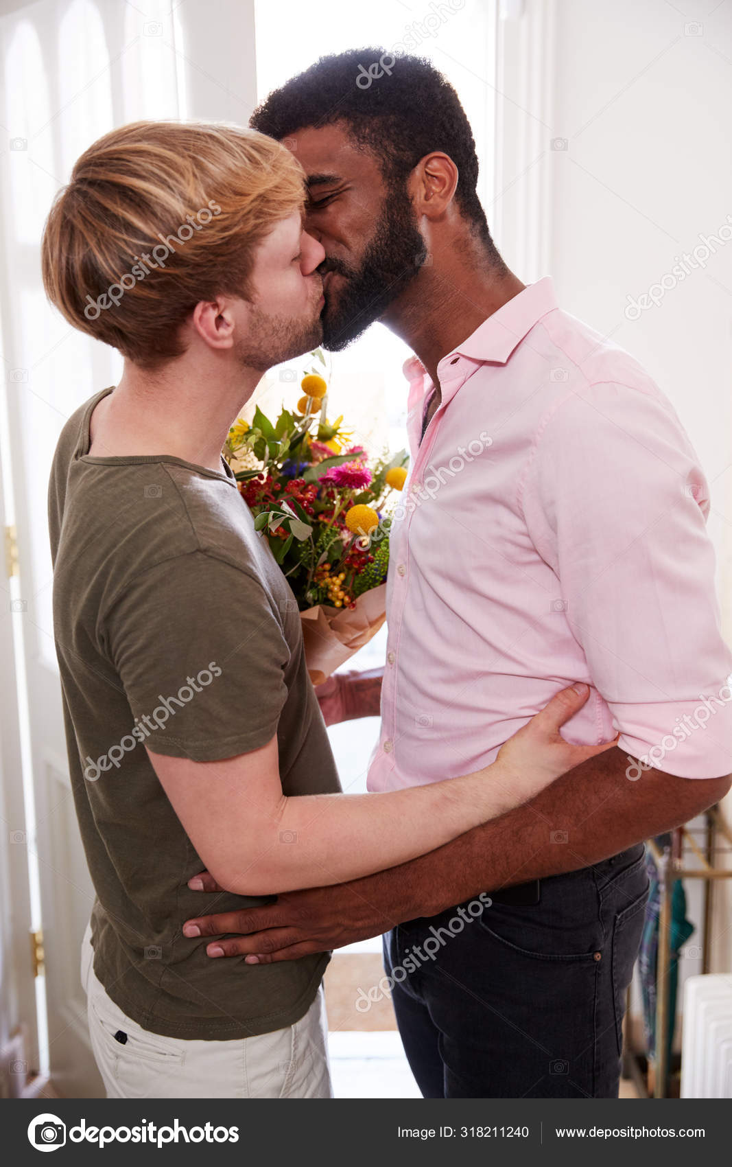 Man Opening Front Door Gay Partner Home Who Gives Him Stock Photo by ©monkeybusiness 318211240 picture
