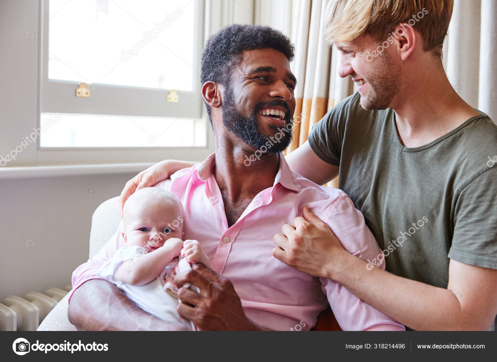 Loving Male Same Sex Couple Cuddling Baby Daughter Sofa Home Stock Photo by ©monkeybusiness 318214496