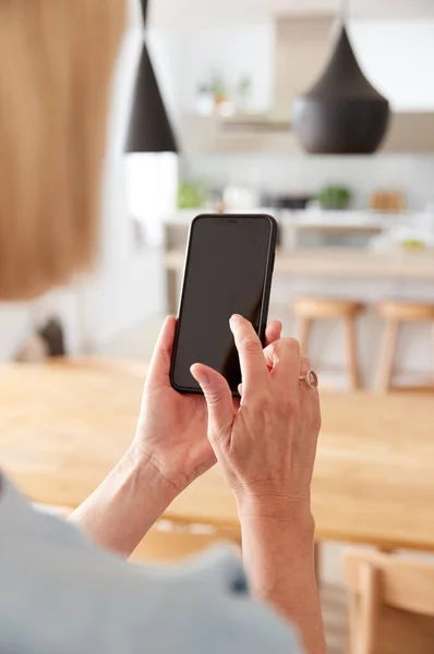 Mature Woman Using App Mobile Phone Control Central Heating Temperature — Stock Photo, Image