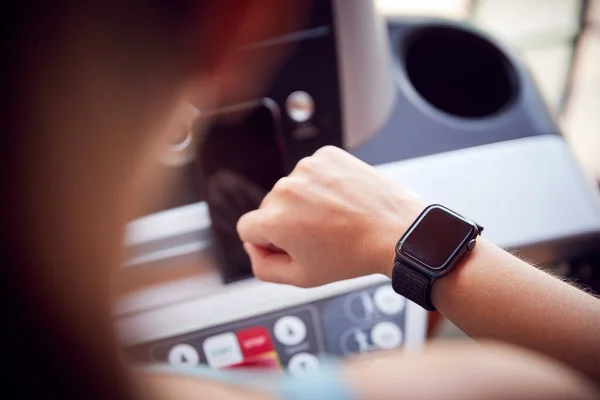 Shoulder View Woman Exercising Treadmill Checking Fitness App Smart Watch — Stock Photo, Image