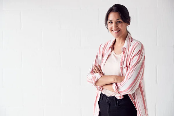 Portrait Of Smiling Casually Dressed Woman Standing Against Whit — Stock Photo, Image