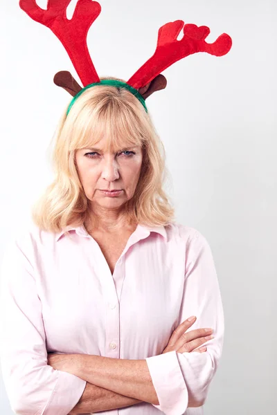 Studio Shot Unhappy Mature Woman Wearing Ddressing Rindeer Antlers White — стоковое фото