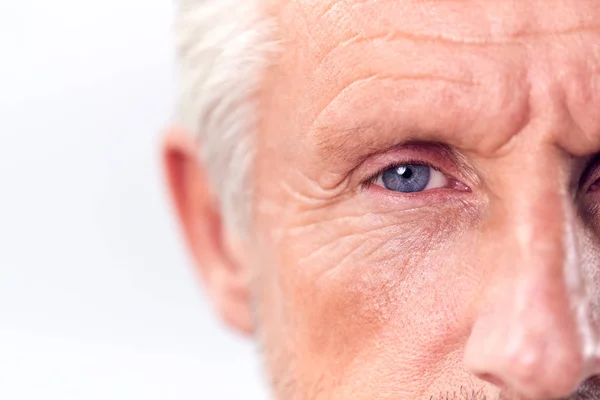 Studio Shot Mature Man Serious Expression Cropped Eyes White Background — стоковое фото