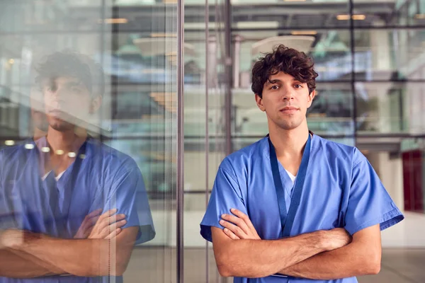 Portrait Young Male Doctor Wearing Scrubs Standing Modern Hospital Building — Stok Foto