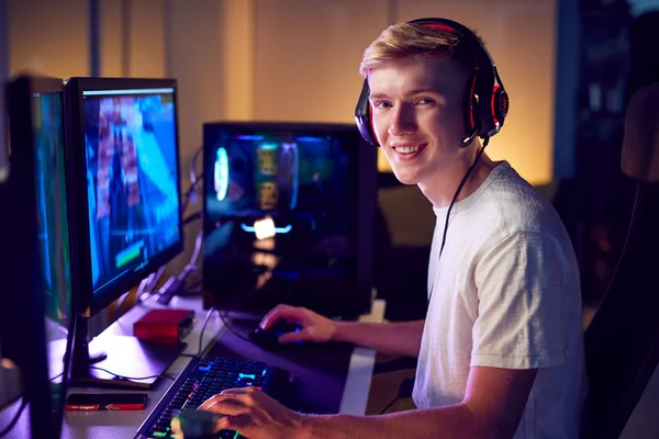 Portrait Teenage Boy Wearing Headset Gaming Home Using Dual Computer — Stock Photo, Image