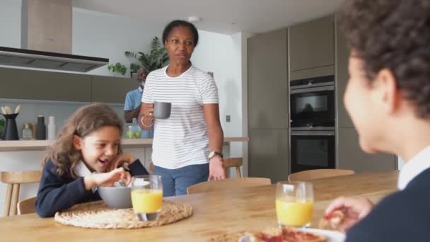 Grandparents Sitting Table Kitchen Grandchildren Eat Breakfast Leaving School Shot — Stock Video