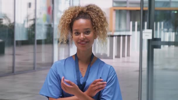 Portrait Female Nurse Wearing Scrubs Standing Modern Hospital Building — Stock Video