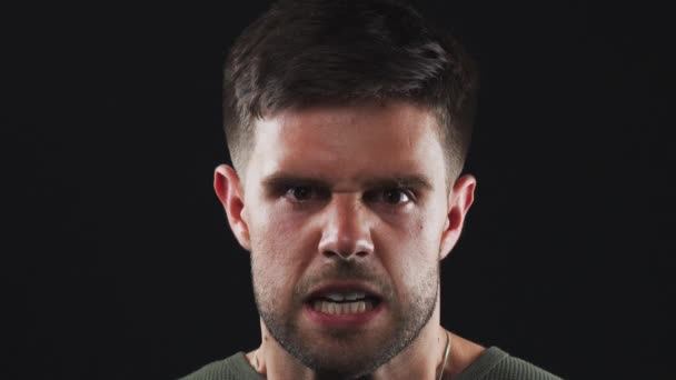 Angry Young Man Shouting Camera Black Studio Background Shot Slow — Stock Video