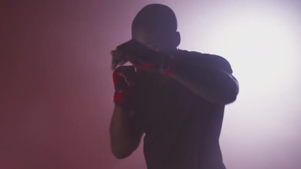 Dramatic Backlit Shot Male Boxer Gym Wearing Wraps Hands Surrounded — Stock Video