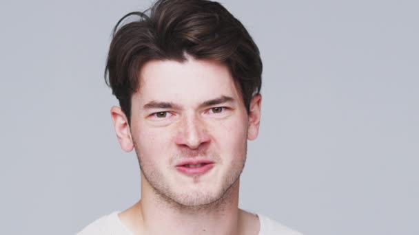 Angry Young Man Shouting Camera White Studio Background Shot Slow — Stock Video