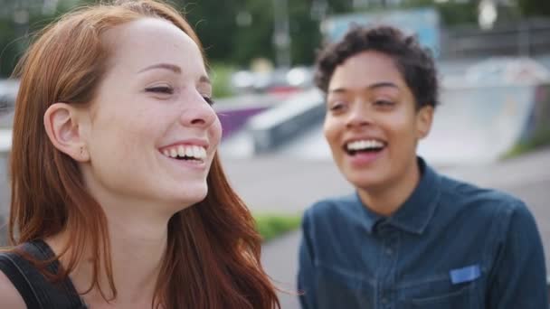 Two Female Friends Talking Laughing Urban Skate Park Shot Slow — Stock Video