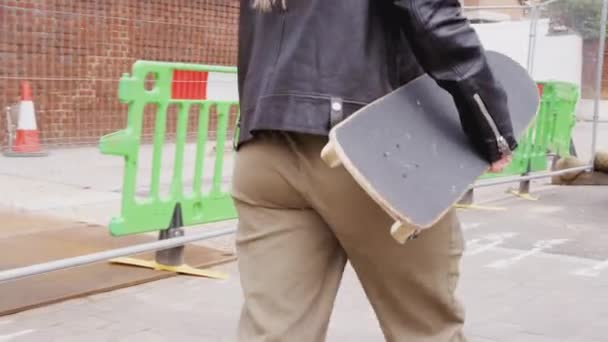 Close Young Women Riding Carrying Skateboards Sidewalk City Street Shot — Stock Video