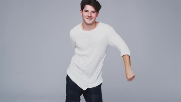 Wide Angle Shot Young Man Dancing Flossing White Studio Background — Stock Video