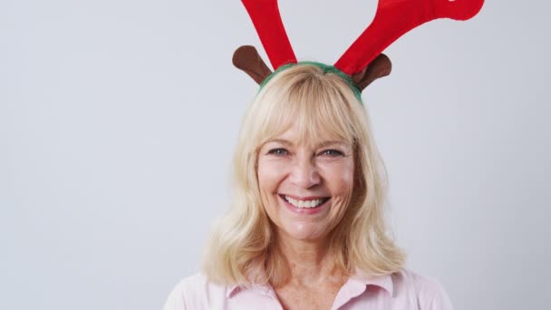 Studio Shot Happy Mature Woman Wearing Dressing Reindeer Antlers White — Stock Video