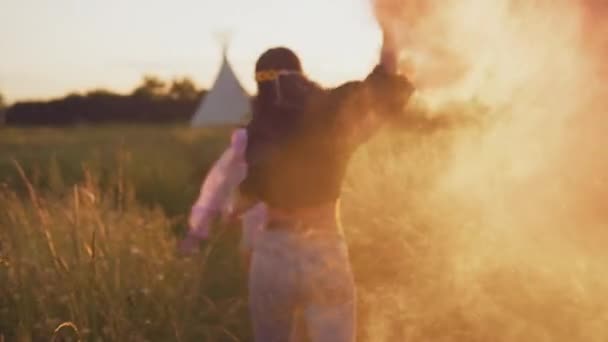 Two Female Friends Camping Music Festival Running Field Waving Smoke — Stock Video