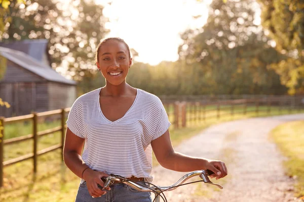 Portrait Young Woman Riding Bike Country Lane Sunset — Stock Photo, Image