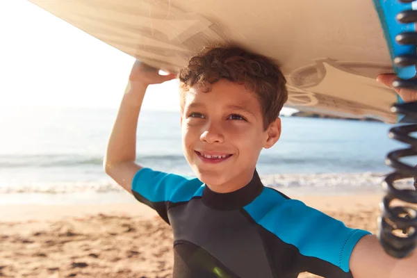 Portrait Smiling Boy Wearing Wetsuit Carrying Bodyboards Summer Beach Vacation — Foto de Stock