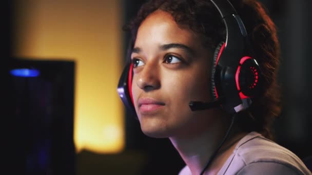 Teenage Girl Wearing Headset Sitting Front Computer Screen Home Gaming — Stock Video