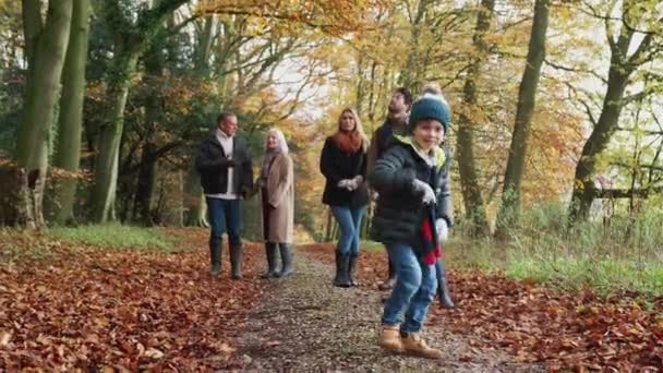 Multi Generation Family Walking Path Autumn Countryside Together Grandson Dances — Stock Video