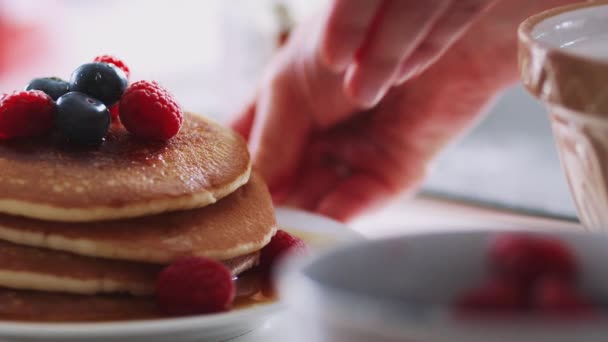 Close Woman Putting Stack Freshly Made Pancakes Maple Syrup Berries — Stock Video