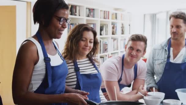 Female Teacher Tossing Flatbread Pan Adult Students Watch Cooking Class — Stock Video