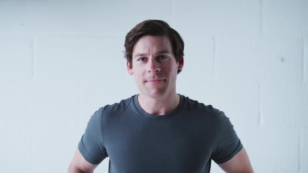 Portrait Smiling Man Wearing Shirt Standing White Studio Wall Shot — Stock Video