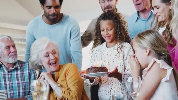 Multi Generation Family Sitting Table Celebrating Grandmothers Birthday Cake Home — Stock Video