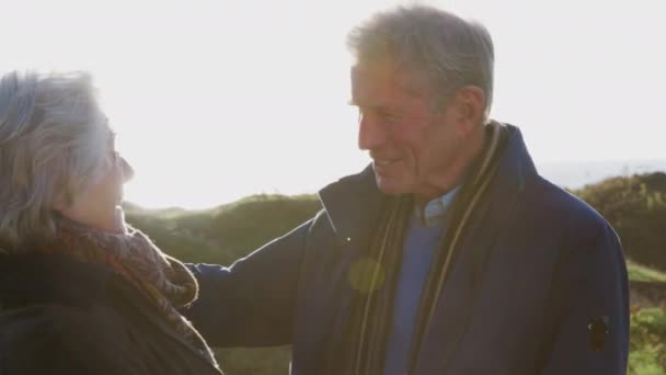 Portrait Loving Senior Couple Hugging Walk Coastal Path Together Flaring — Stock Video