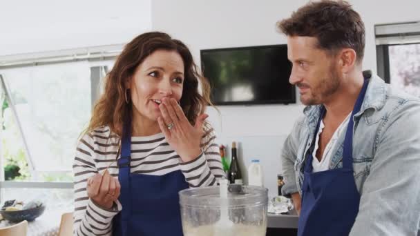 Man Woman Wearing Aprons Tasting Ingredients Dish Kitchen Cookery Class — Stock Video