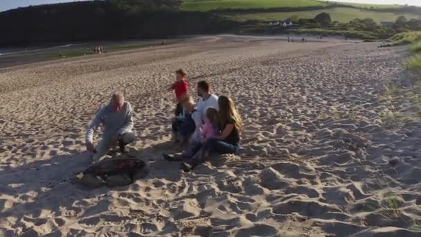 Drone Shot Multi Generation Family Enjoying Evening Beach Barbecue Grandfather — Stock Video