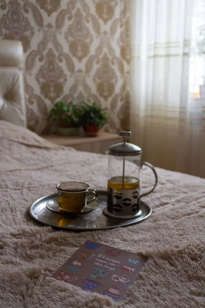 Child Lies Bed Holds His Hands Card Next Tray Cup — Stock Photo, Image