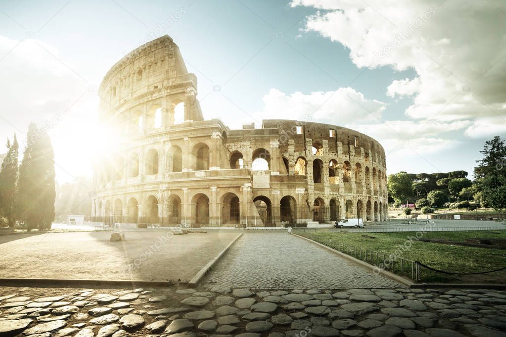 Colosseum in Rome and morning sun, Italy