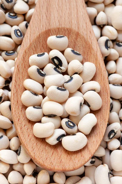 Black-eyed Beans in wooden spoon background , full frame. — Stok fotoğraf