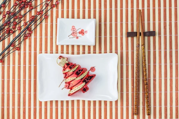 Sushi on table, background Christmas tree plate Stock Picture