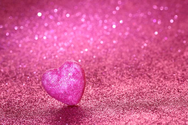 Den svatého Valentýna růžový glitter pozadí se srdcem — Stock fotografie