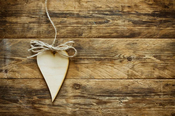 Valentine's day plywood heart hangind on rope — Stock Photo, Image