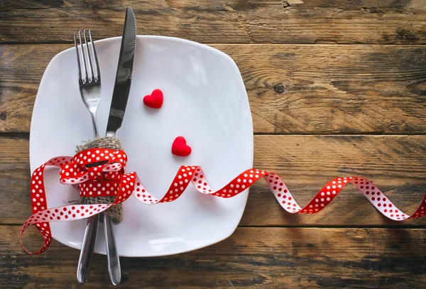 valentine\'s day background, white plate, fork, knife