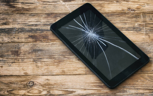 broken tablet computer, cracked glass display
