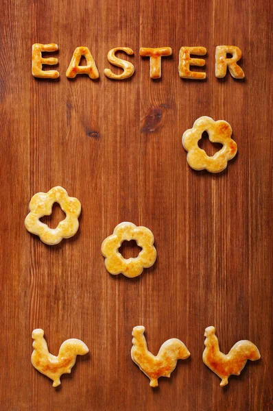 Easter decoration with cookies letters and cocks