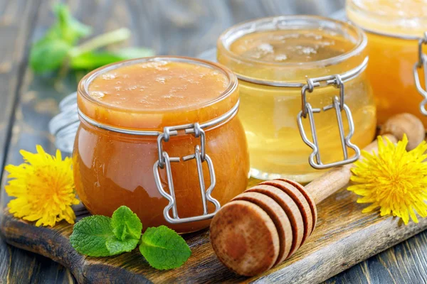 Buckwheat and lime honey in glass jars.