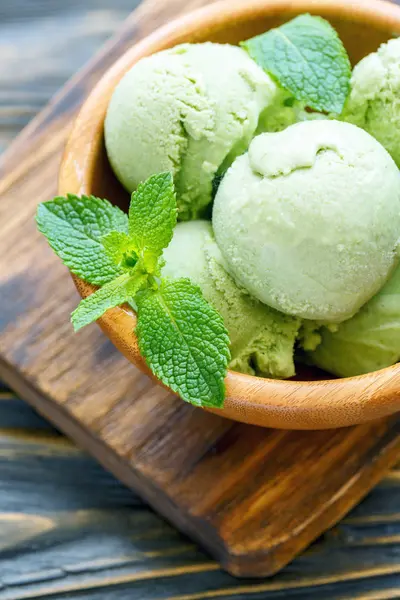 Balls homemade mint ice cream in a bowl.