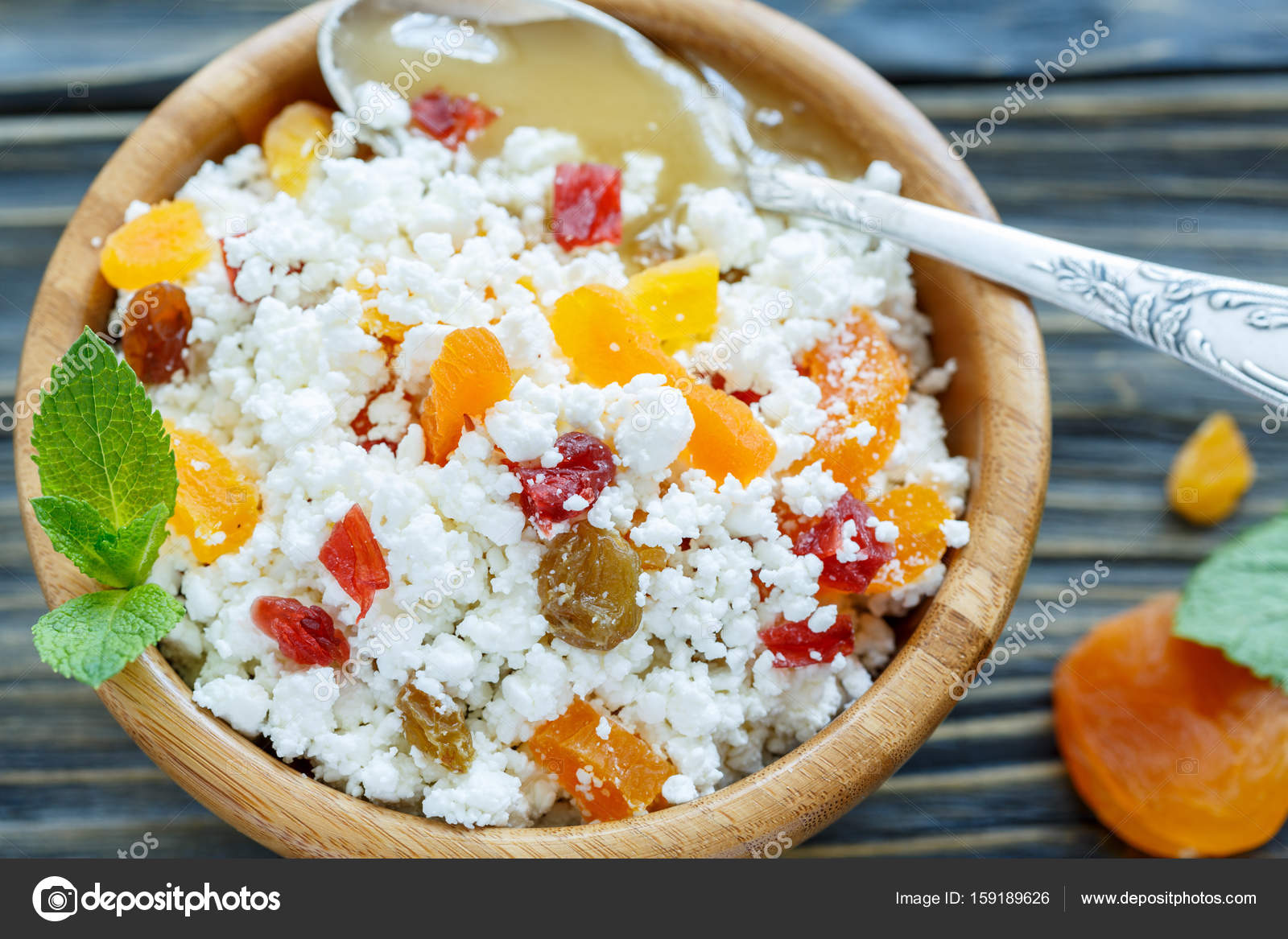 Bowl Of Cottage Cheese Dried Fruit And Honey Close Up Stock