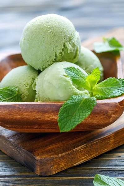 Homemade mint ice cream and mint leaves.